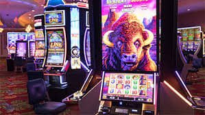 Filipino player spinning online slot games on a smartphone